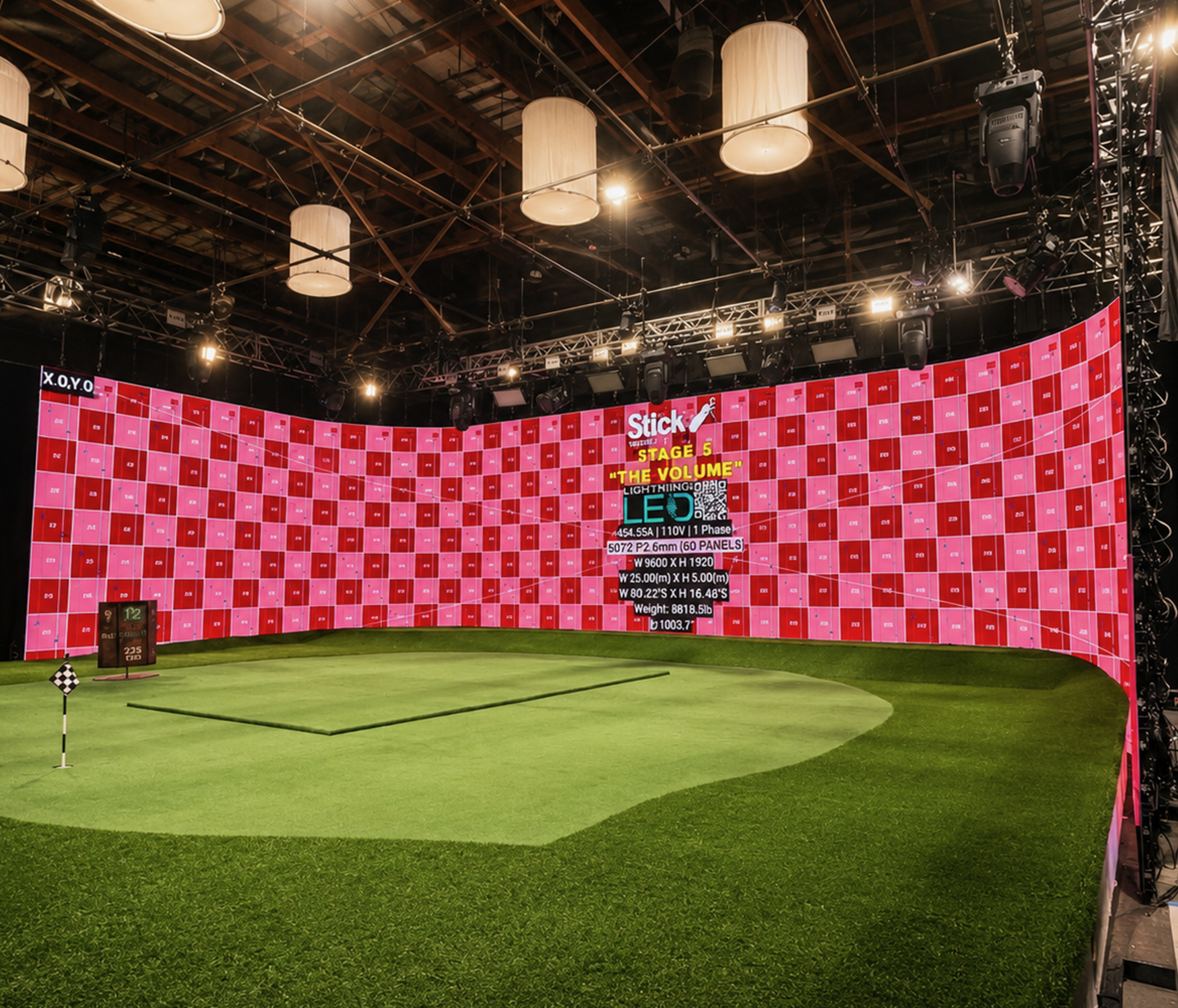 Multiple LED walls with red, yellow, blue, and green calibration charts on a soundstage.